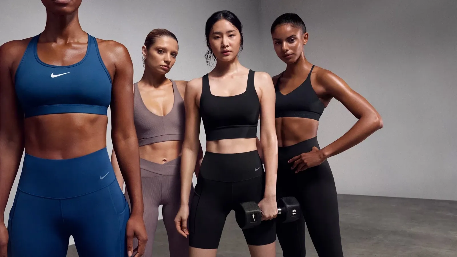 Runners in Nike sports bras standing side by side