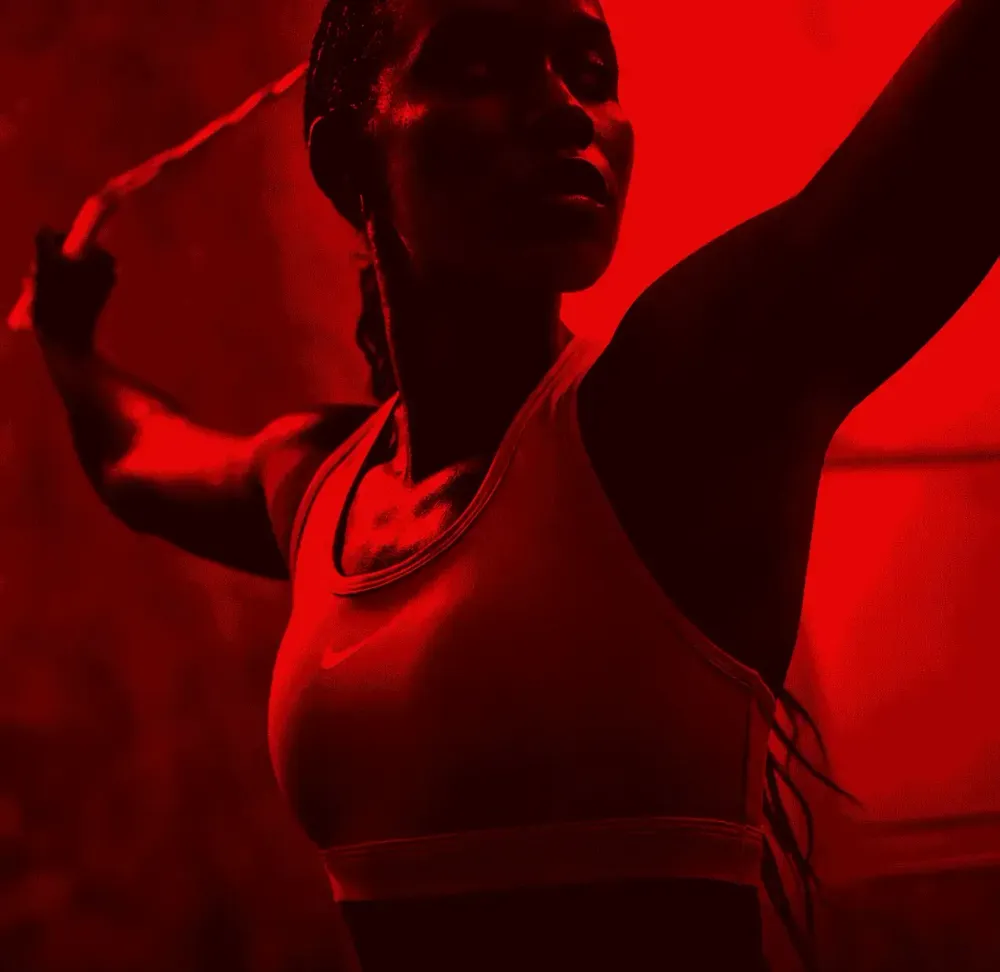 A runner wearing a high-neck Nike sports bra