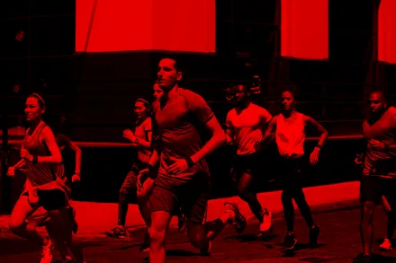 Runner starting out on a red-lit street