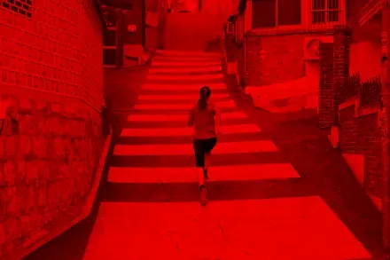 A runner climbing a flight of outdoor steps