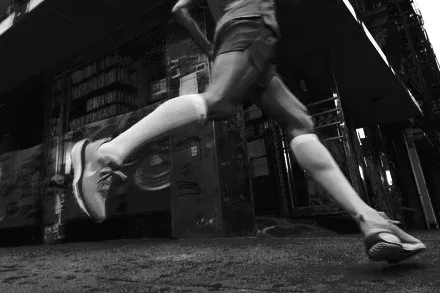 A runner's legs and shoes after a run