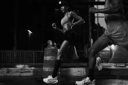 Runners on a street at night