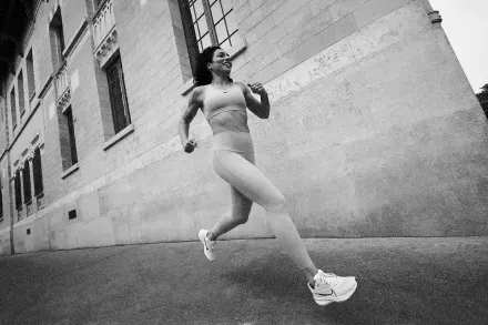 A runner beside a stone building
